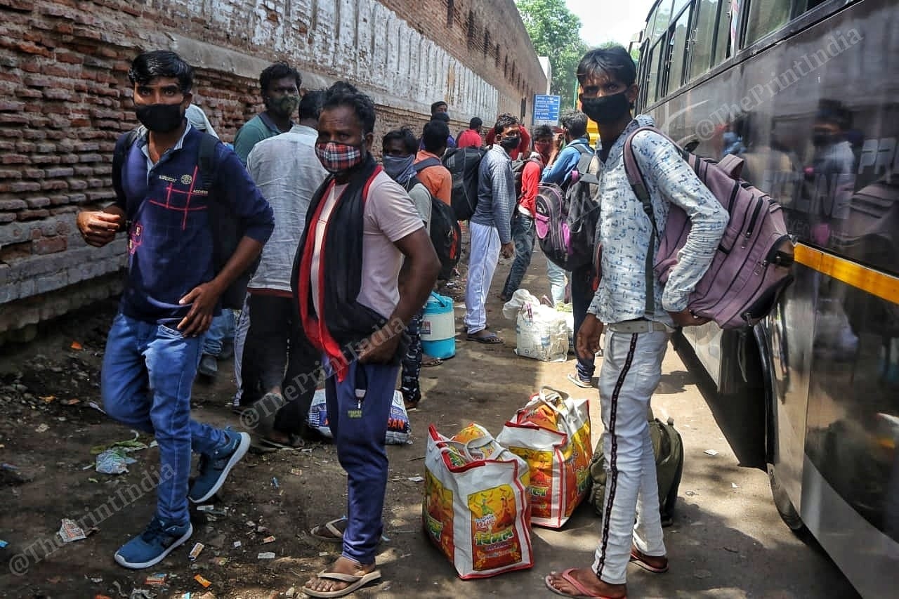 Travel agent deals with migrant workers in Astodia area of Ahmedabad | Photo: Praveen Jain | ThePrint