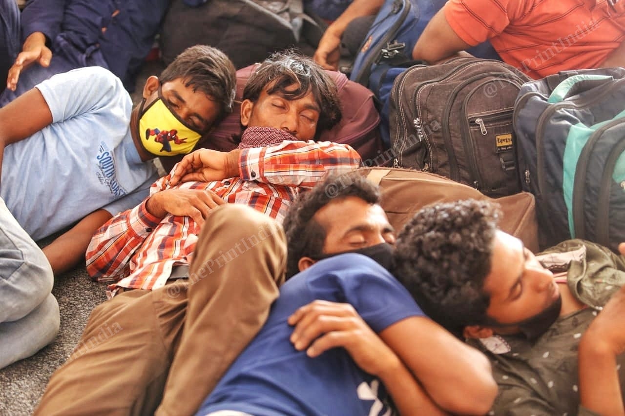 Migrants take a nap while waiting for their trains | Photo: Praveen Jain | ThePrint