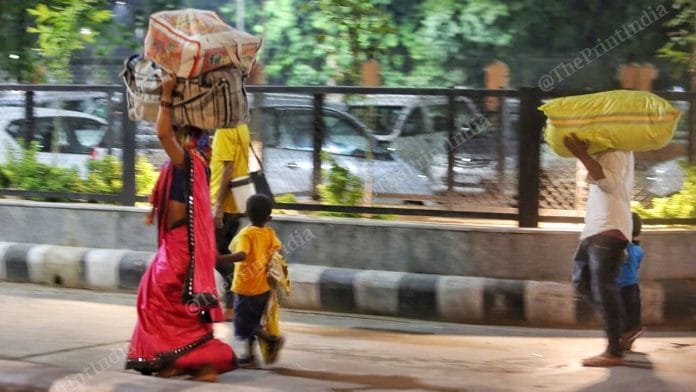 A family of migrant workers walks towards the railway station | Photo: Praveen Jain | ThePrint