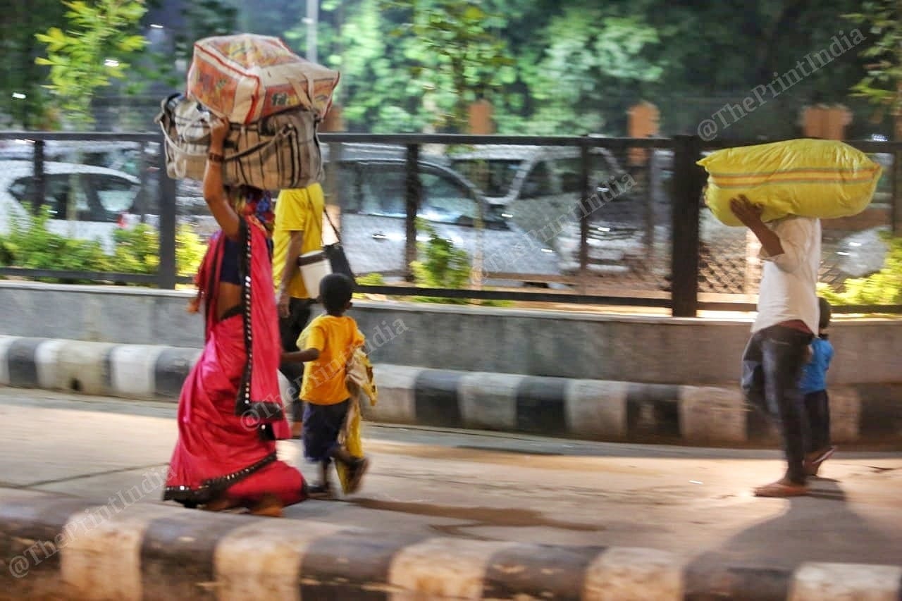A family of migrant workers walks towards the railway station | Photo: Praveen Jain | ThePrint