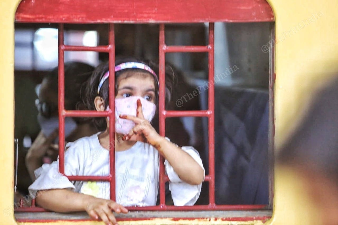 A girl waits for the train to start | Photo: Praveen Jain | ThePrint