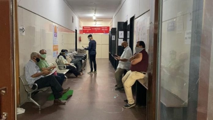 People await vaccination outside the immunisation centre at Bhopal’s Jai Prakash District Hospital. The number of people turning up at vaccination centres in MP is believed to have fallen sharply | Representational image | Revathi Krishnan | ThePrint