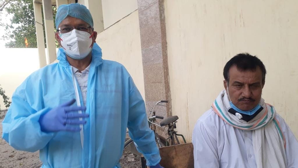 Anoop Mishra (in blue PPE kit) who was at the Bhairav Ghat crematorium Thursday to cremate his 31-year-old cousin Abhishek who died of Covid | Photo: Moushumi Das Gupta/ThePrint