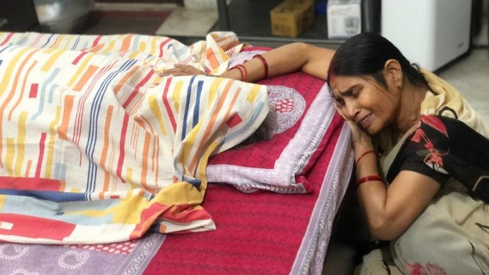 Aruna Srivastava weeps next to her husband Vinay Srivastava's body in Lucknow Saturday. Vinay died of Covid-like symptoms without test results or medical care | Photo: Jyoti Yadav | ThePrint