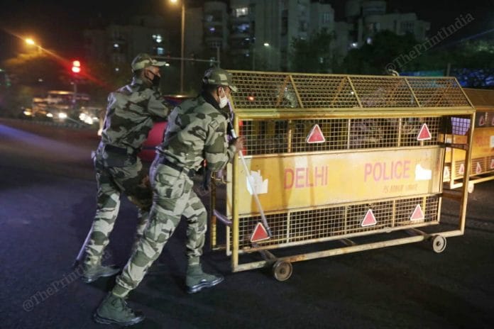 Security personnel during night curfew in New Delhi on 13 April 2021