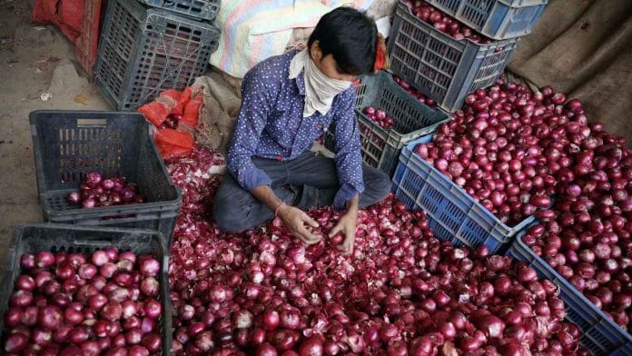 Representational image of an onion seller at Delhi's Azadpur Mandi | File photo: ANI