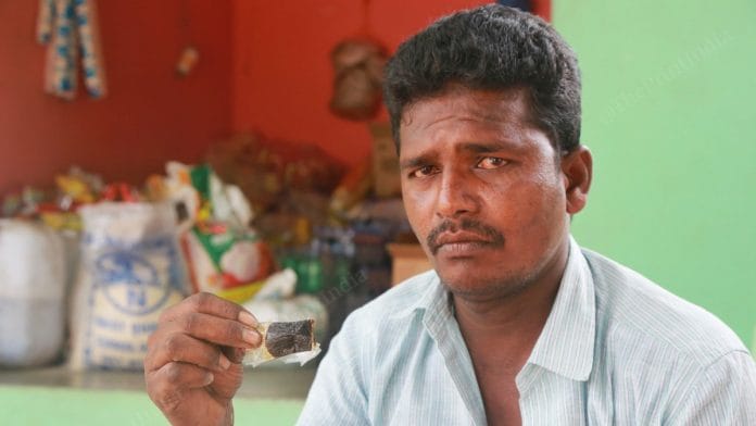 Krishnapatnam resident Krishna shows a packet containing the concoction that's supposed to be a 'miracle' Covid cure | Photo: Manisha Mondal | ThePrint