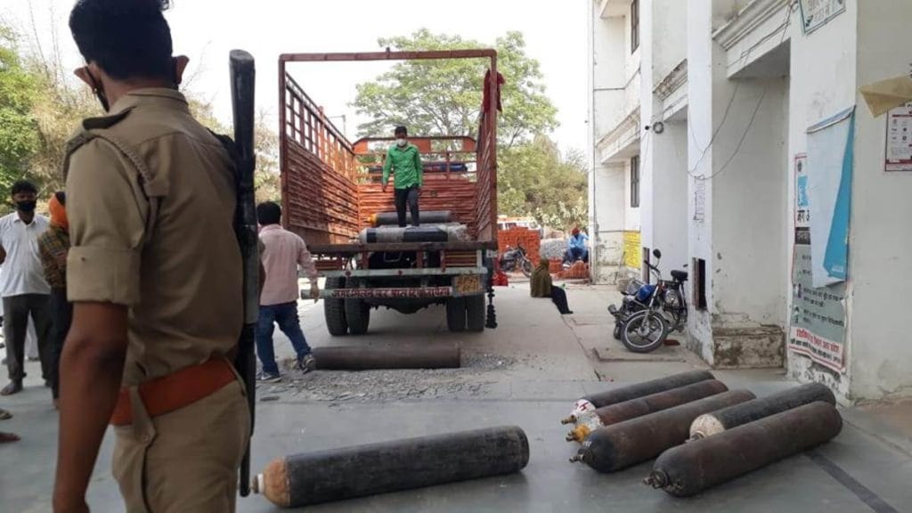 Oxygen cylinders being unloaded from a truck at the Dasratha Medical College in police presence Saturday | Photo: Moushumi Das Gupta | ThePrint