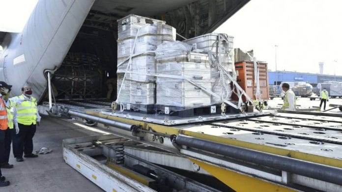 Personnel offload Covid aid sent by Italy to help India in its Covid crisis | MEA | Twitter