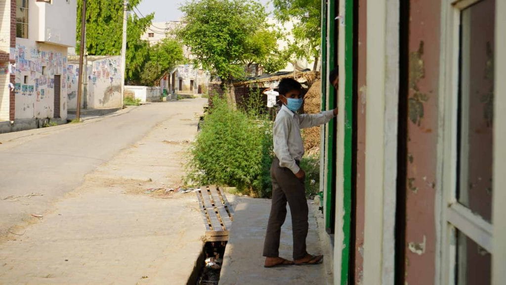 A child wearing a mask on the empty streets of Bijauli as UP remains in lockdown due to the Covid-19 surge | Photo: Reeti Agarwal | ThePrint