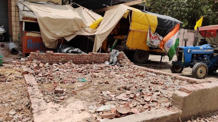 Rubble of the now-demolished Kisan Social Army tent at the Tikri border protest site on the outskirts of Delhi where the alleged gang rape and sexual assault took place | Photo: Bismee Taskin | ThePrint