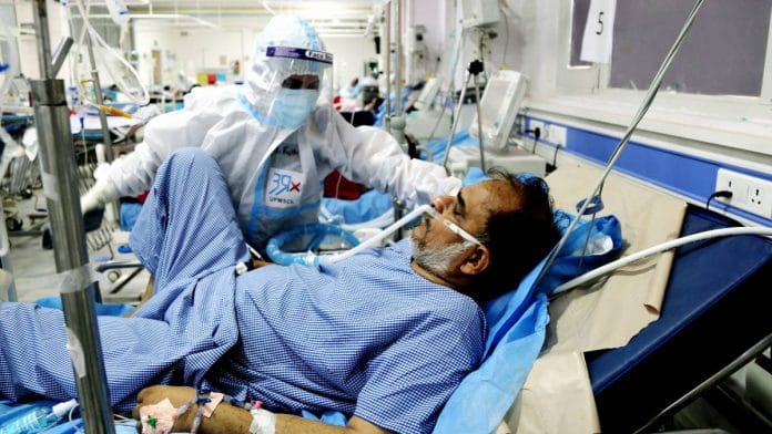 A medic treats a patient at a Covid-19 ward of Era's Lucknow Medical College and Hospital in Lucknow on 7 May 2021 | ANI