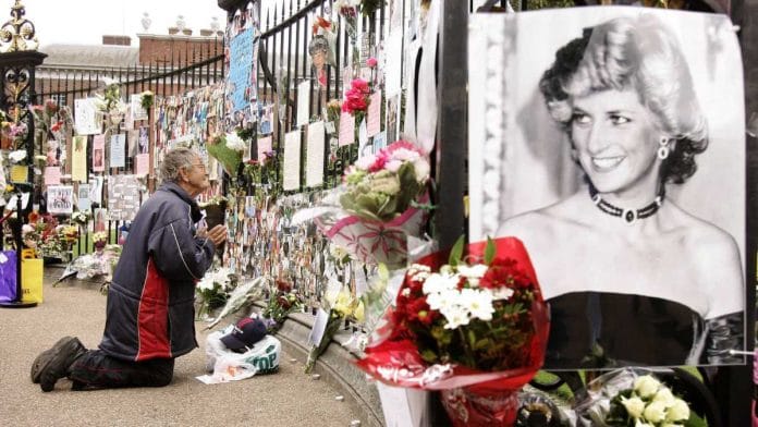 A man prays near the gates of Kensington Palace in London, UK, in August 2007. Diana, Princess of Wales, was honoured on the 10th anniversary of her death at a memorial in London organized by her sons, Princes William and Harry | Shaun Curry | Bloomberg