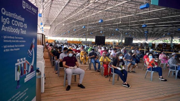 Beneficiaries above 18 years old wait for their turn to get the Covid-19 vaccine, at Radha Swami Satsang vaccination centre in New Delhi on 6 May 2021 | ANI