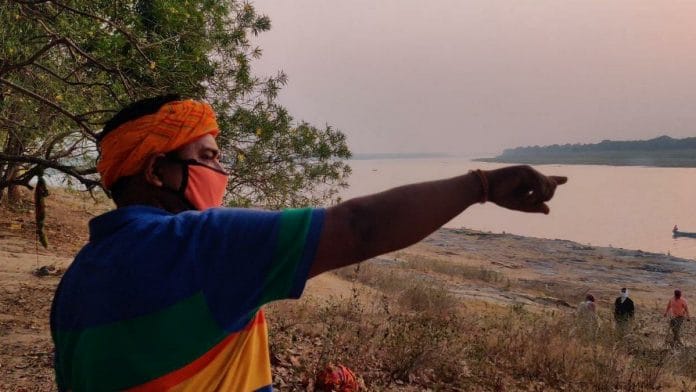 Ramashray Singh, deputy sarpanch of Chausa in Buxar district of Bihar, points to Mahadev Ghat where 71 dead bodies floating down the Ganga were buried | Photo: Sajid Ali | ThePrint