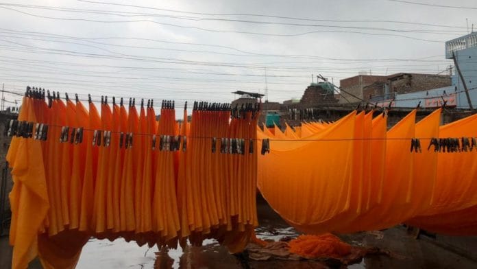 Saffron shrouds on the terrace of Jitendra Prasad’s three-storeyed home at Patwa Toli village | Photo: Jyoti Yadav/ThePrint