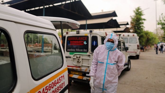 Ambulances lined up at a crematorium on the outskirts of New Delhi, on 23 April 2021 | Image via Bloomberg