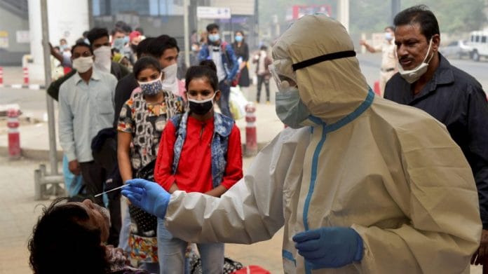 A health worker conducts rapid antigen tests in Delhi | Representational image | PTI
