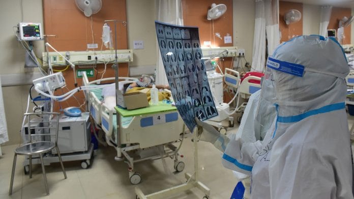 A doctor checks CT Scan of a Covid patient in Greater Noida (file photo) | PTI Photo