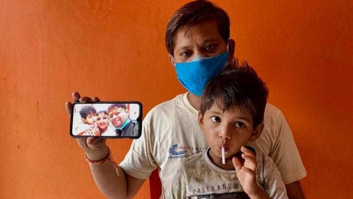 Pankaj Jain, with his son on his lap, shares memories of happier times, a photo with wife, Priyanka | Nirmal Poddar | ThePrint