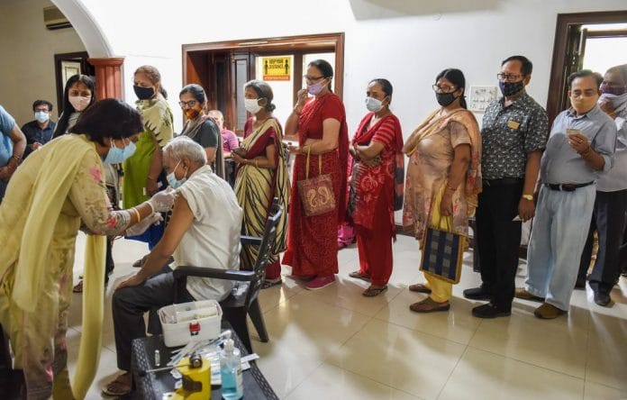 Representational image | File photo of people in a queue for Covid vaccines in Gurugram | PTI