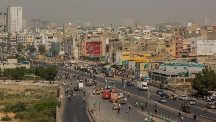 Vehicles travel along a road in the Clifton area of Karachi, Pakistan (Representational image) | Photographer: Asim Hafeez/Bloomberg