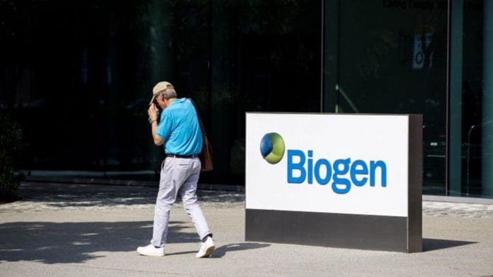 A pedestrian walks past Biogen Inc. headquarters in Cambridge, Massachusetts, US on 7 June 2021 | Bloomberg