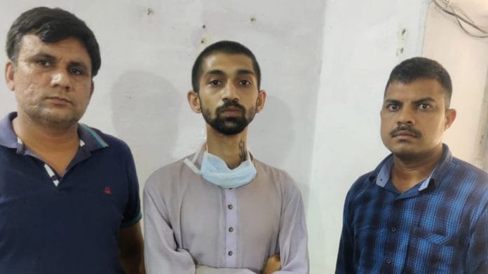 MC Kode (in centre) after he was traced in Madhya Pradesh | By special arrangement