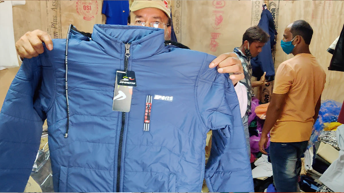Wakeel Ahmed, one of the entrepreneurs at the zone, shows a jacket manufactured by his unit | Sajid Ali | ThePrint
