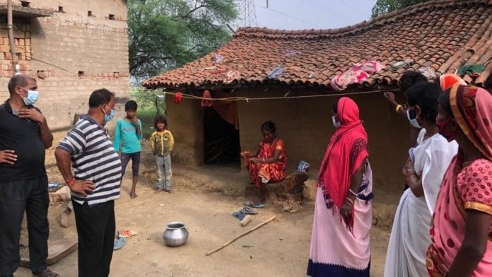 A local seeking to convince Mahadalits in Amarpur tola to take Covid-19 vaccination. | Photo: Jyoti Yadav/ThePrint