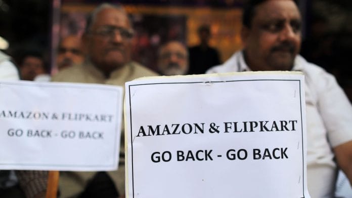 Merchants display placards during a sit-in protest at Sadar Bazaar in New Delhi | Bloomberg