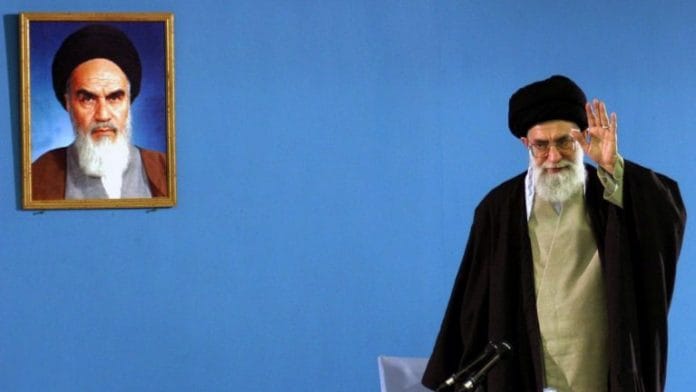 The Supreme Leader of Iran Ayatollah Sayyid Ali Khamenei waves after speaking to a group of laborers in Tehran, Iran | Bloomberg