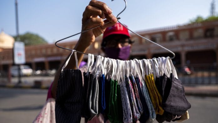 Protective masks being sold by a vendor in Jaipur