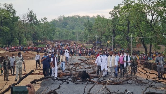 Tribals blocking a road in Silger village as local public representatives take stock of the situation at the protest site. | Photo by special arrangement