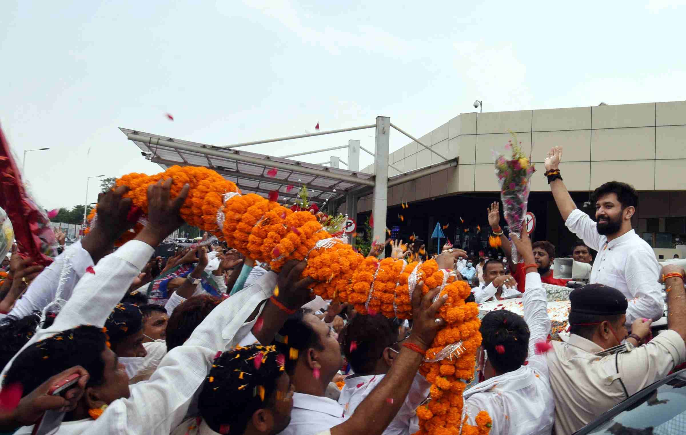 LJP leader Chirag Paswan is welcomed by party supporters at Patna airport during his 'Ashirvad Yatra' Monday | ANI