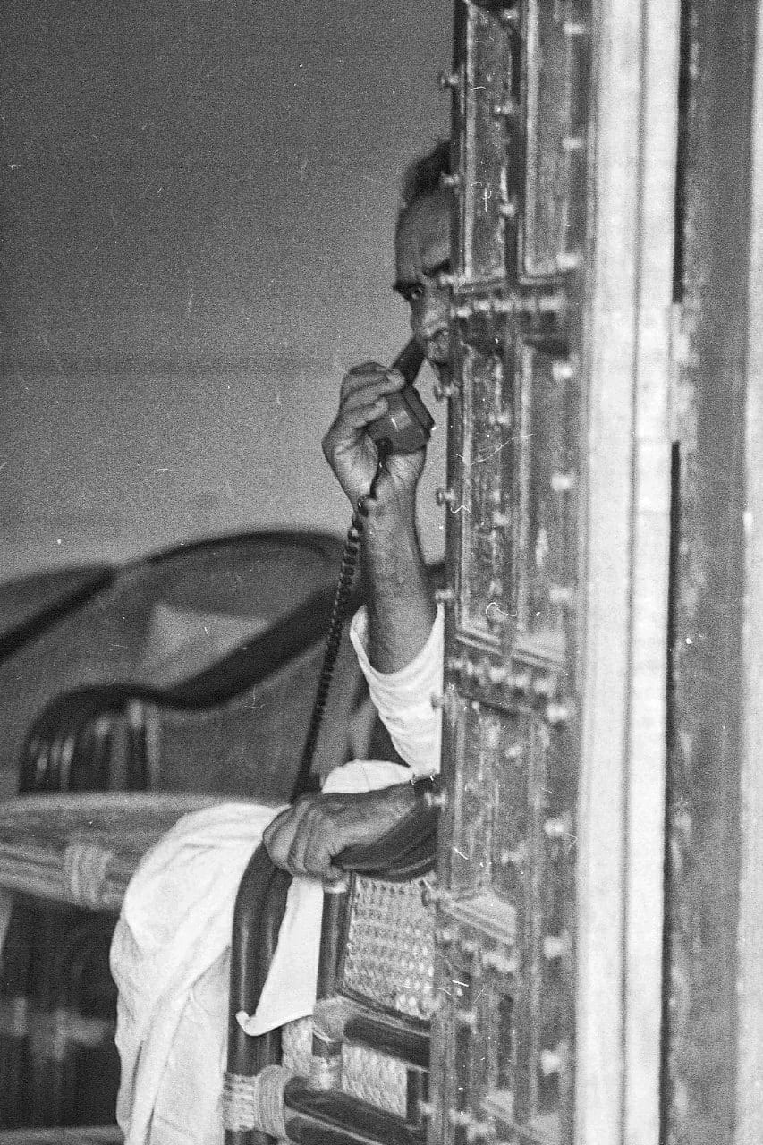 Chandra Shekhar talks on phone at his ashram in Bhonsdi village, Gurugram | Photo: Praveen Jain 