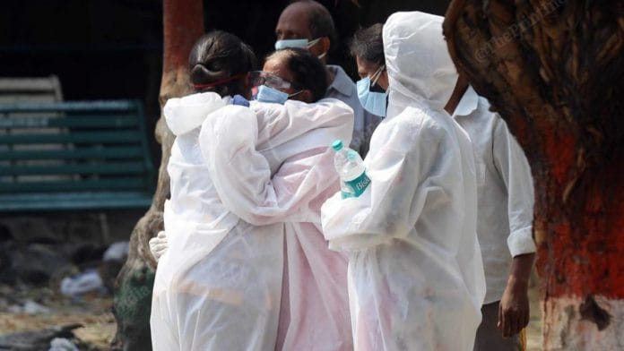 Family members of deceased Covid patients comfort each other | Representational image | Suraj Singh Bisht | ThePrint