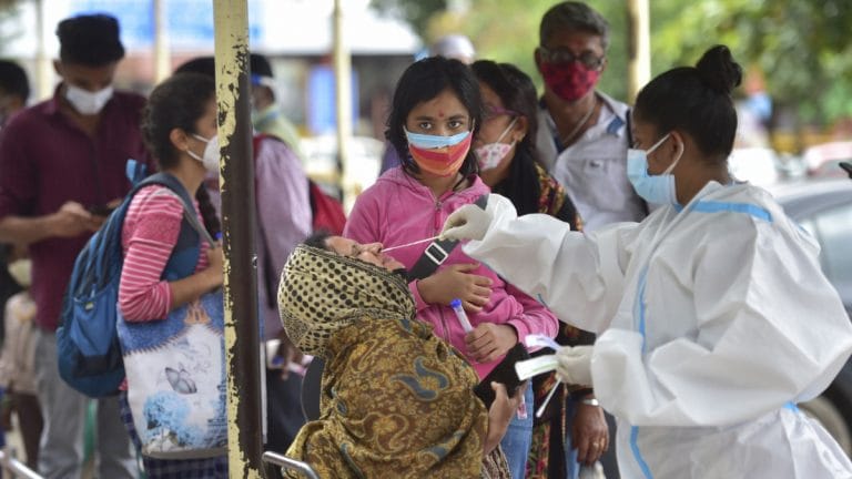 Why the world may never reach herd immunity against Covid-19