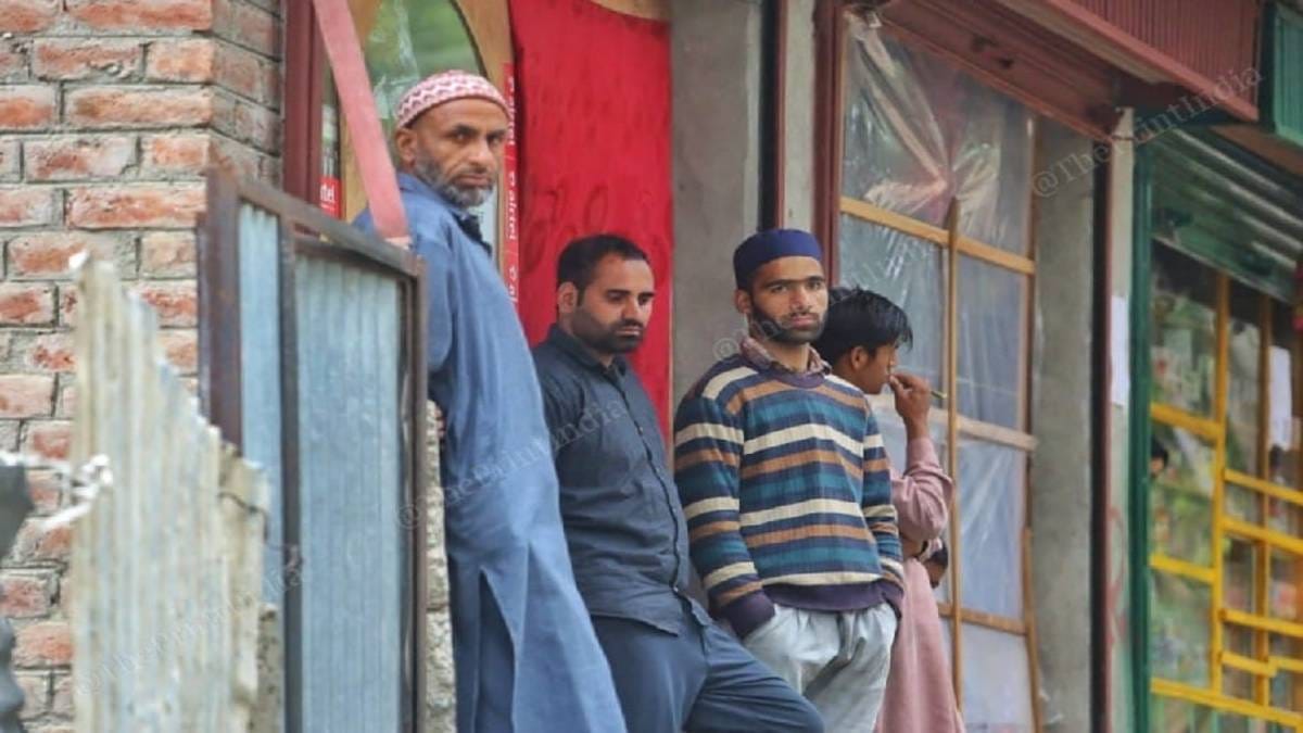 Shopkeeper Mohammad Ashraf ( in a black shirt ) said he does not ‘trust the vaccine of India’. He is waiting for the Pfizer vaccine. | Praveen Jain | The Print