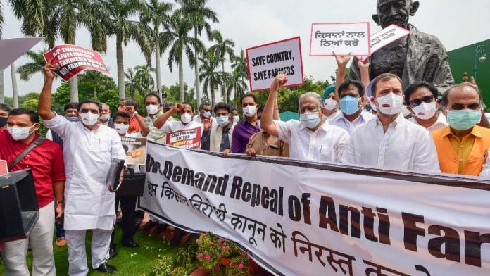 Congress leader Rahul Gandhi (second right) with other opposition members takes part in a protest against the farm reform laws, during the monsoon session of Parliament, in New Delhi, on 22 July 2021 | Kamal Kishore | PTI