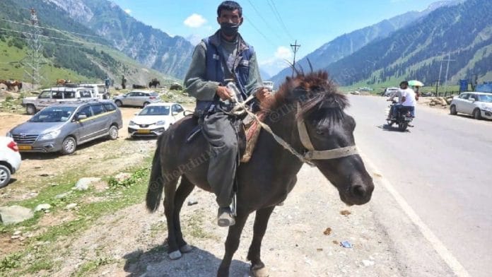 Farooq Ahmed Bhatt (40) is among the porters who offer tourists horse rides around Sonmarg | Praveen Jain | ThePrint