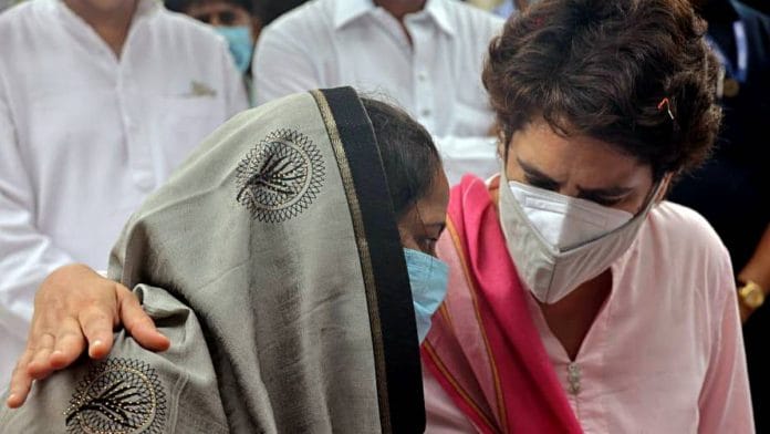 Congress General Secretary Priyanka Gandhi meets a Samajwadi Party (SP) worker who was allegedly manhandled by BJP workers during the panchayat election, in Lakhimpur on 17 July 2021 | ANI