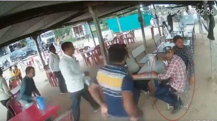 A screen grab from the video of a man being arrested by the Ahmedabad police crime branch