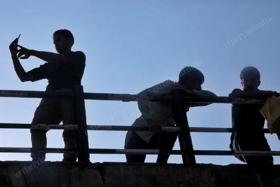 Local villagers watching match on the top of the bridge at Nihama cricket stadium. Kulgam | Photo: Praveen Jain | ThePrint