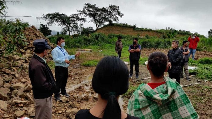 Dr Sunil Kamei counselling villagers about the Covid vaccine, in Manipur | Simrin Sirur | ThePrint