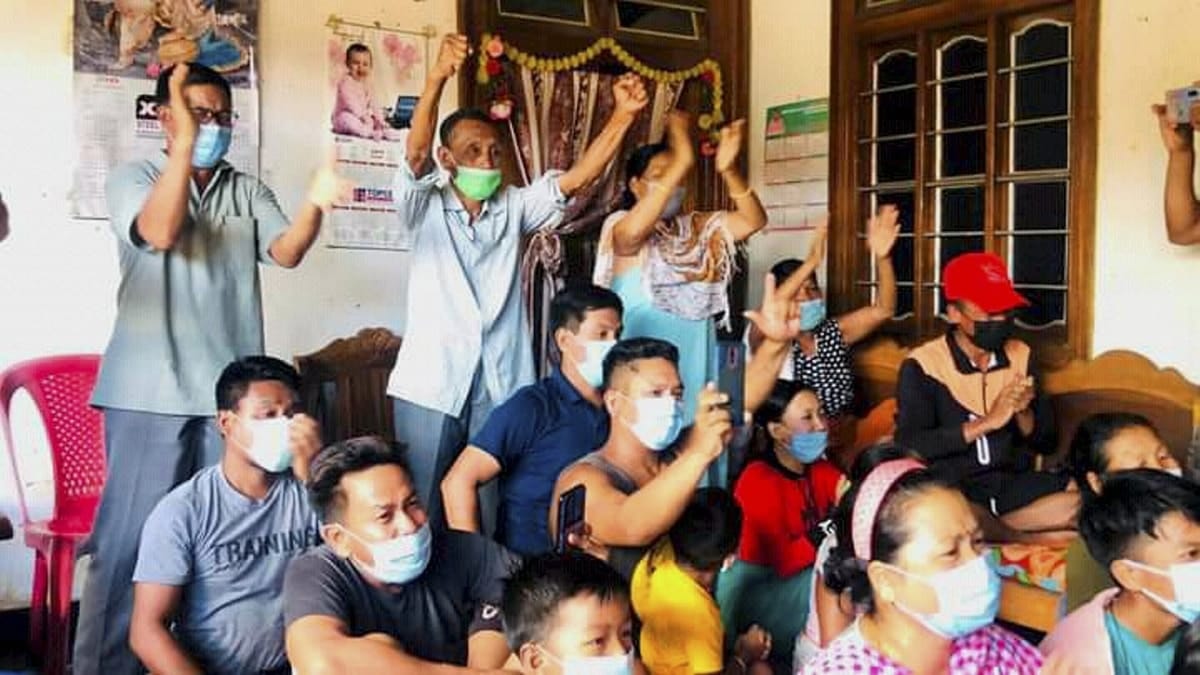 Family members and neighbours of Mirabai Chanu gather to watch the lift at Tokyo 2020. Chanu won a silver in women's weightlifting 49kg category. | Photo: PTI