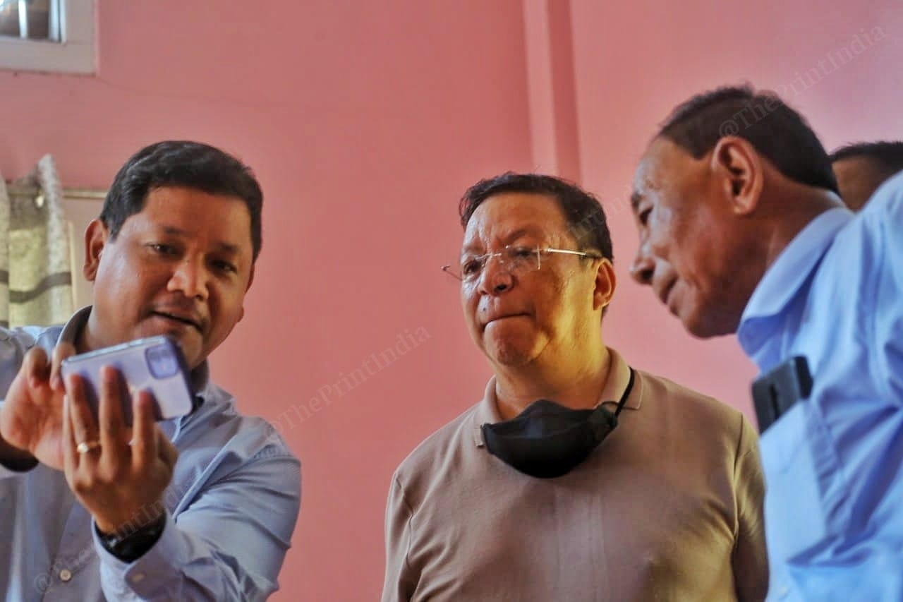 Chief Minister of Meghalaya Conrad Sangma showing important photos to his party MLA's at Tura | Photo: Praveen Jain | ThePrint