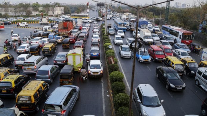 Vehicles sit in traffic during the evening rush hour in the Bandra East area of Mumbai | Photographer: Vivek Prakash | Bloomberg