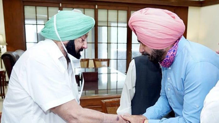 Punjab CM Amarinder Singh with state Congress president Navjot Singh Sidhu in Chandigarh on 27 July 2021 | ANI