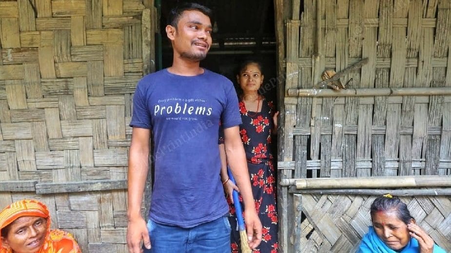 Debu Devbarman, a labourer from the area, and his sister Deepali RAi (standing behind him) | Photo: Praveen Jain/ThePrint